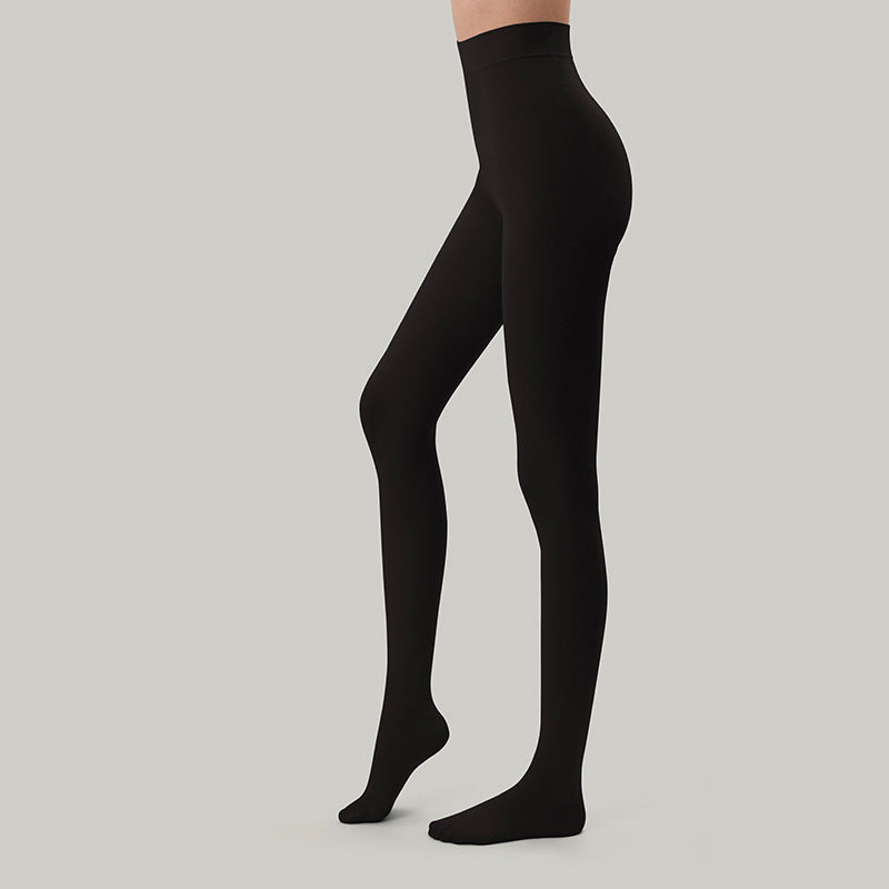 Opaque black velvet pantyhose on legs, full-length tights to the toes