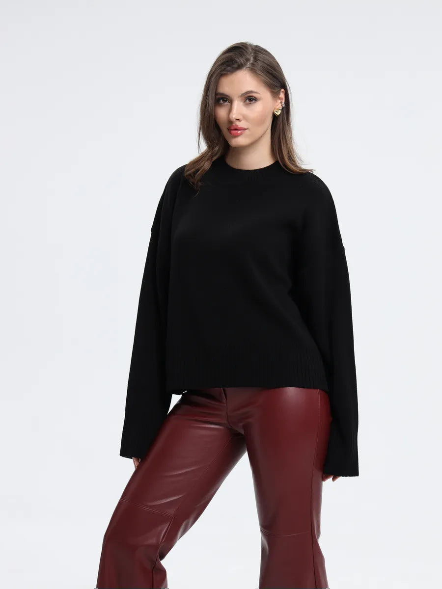 Black oversized mock neck drop-shoulder sweater with ribbed knit cuffs