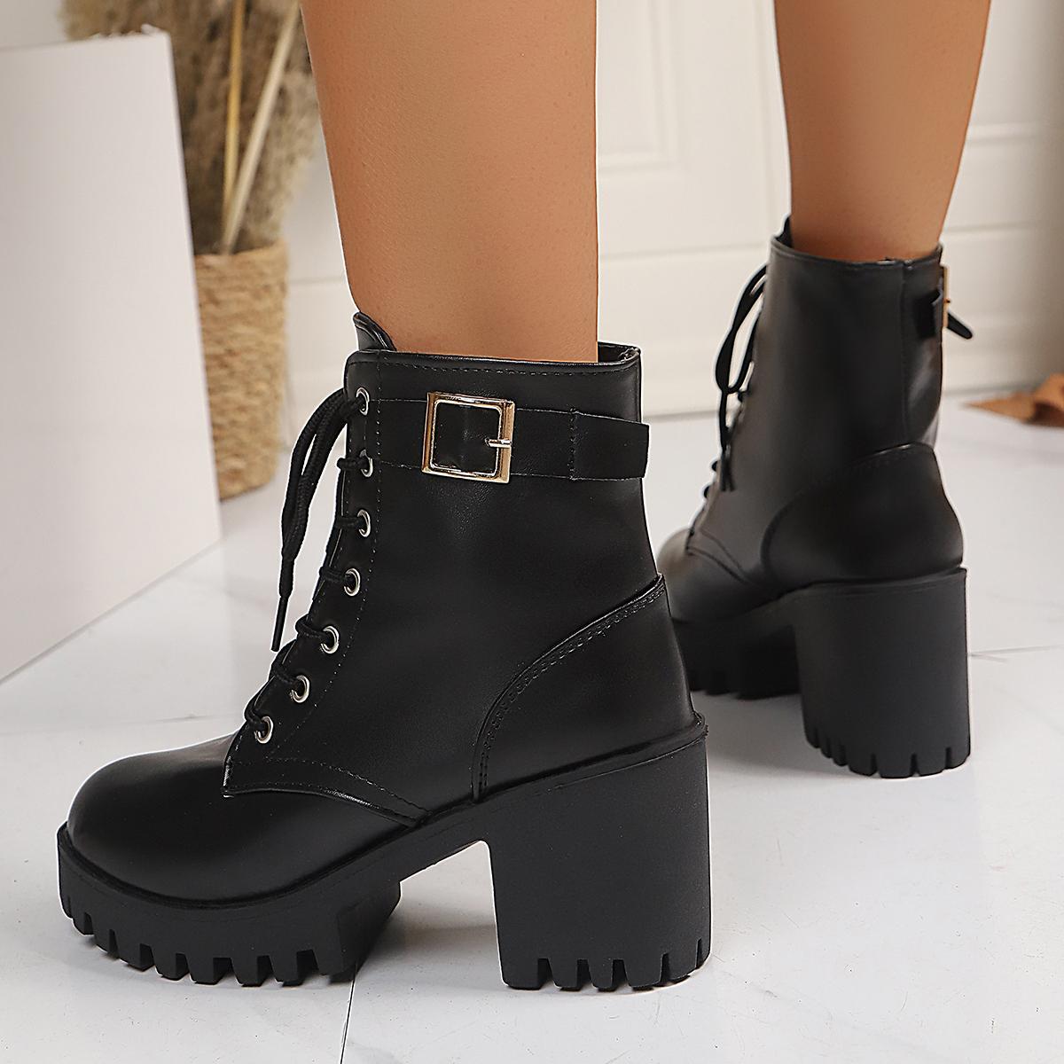 Women’s black lace-up chunky-heel boots with round toe and strap buckle at ankle
