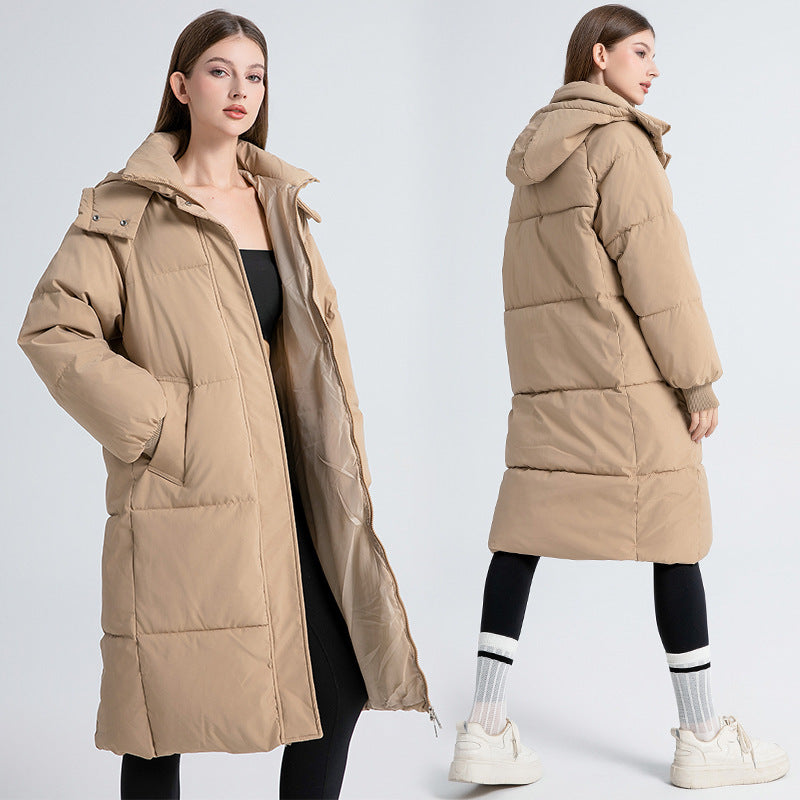 Women’s long hooded puffer cotton coat in tan beige, zip front, side pockets.