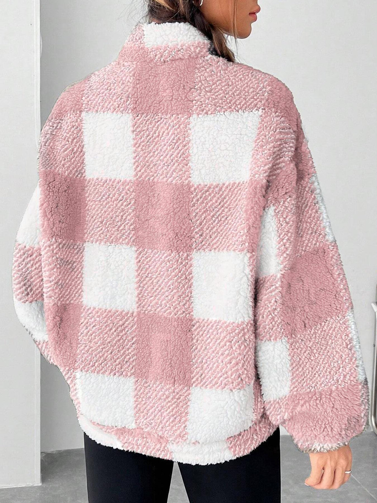 Pink and white plaid fuzzy half-zip sweatshirt with half-open collar, back view