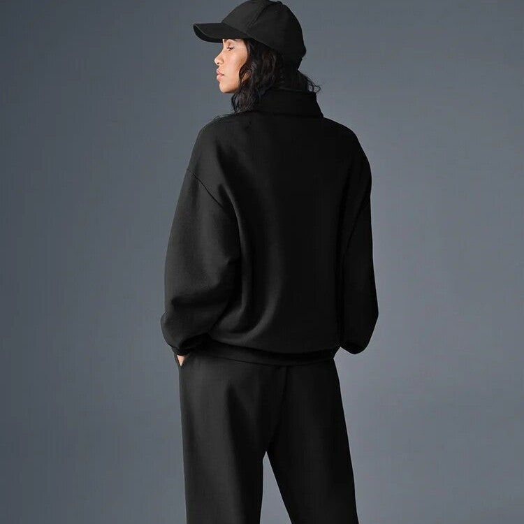 Black half-zip pullover sweatshirt with stand collar and long sleeves, rear view