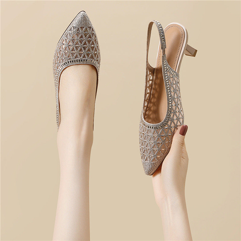 Silver pointed-toe slingback heels with geometric cutout pattern, front and side views.