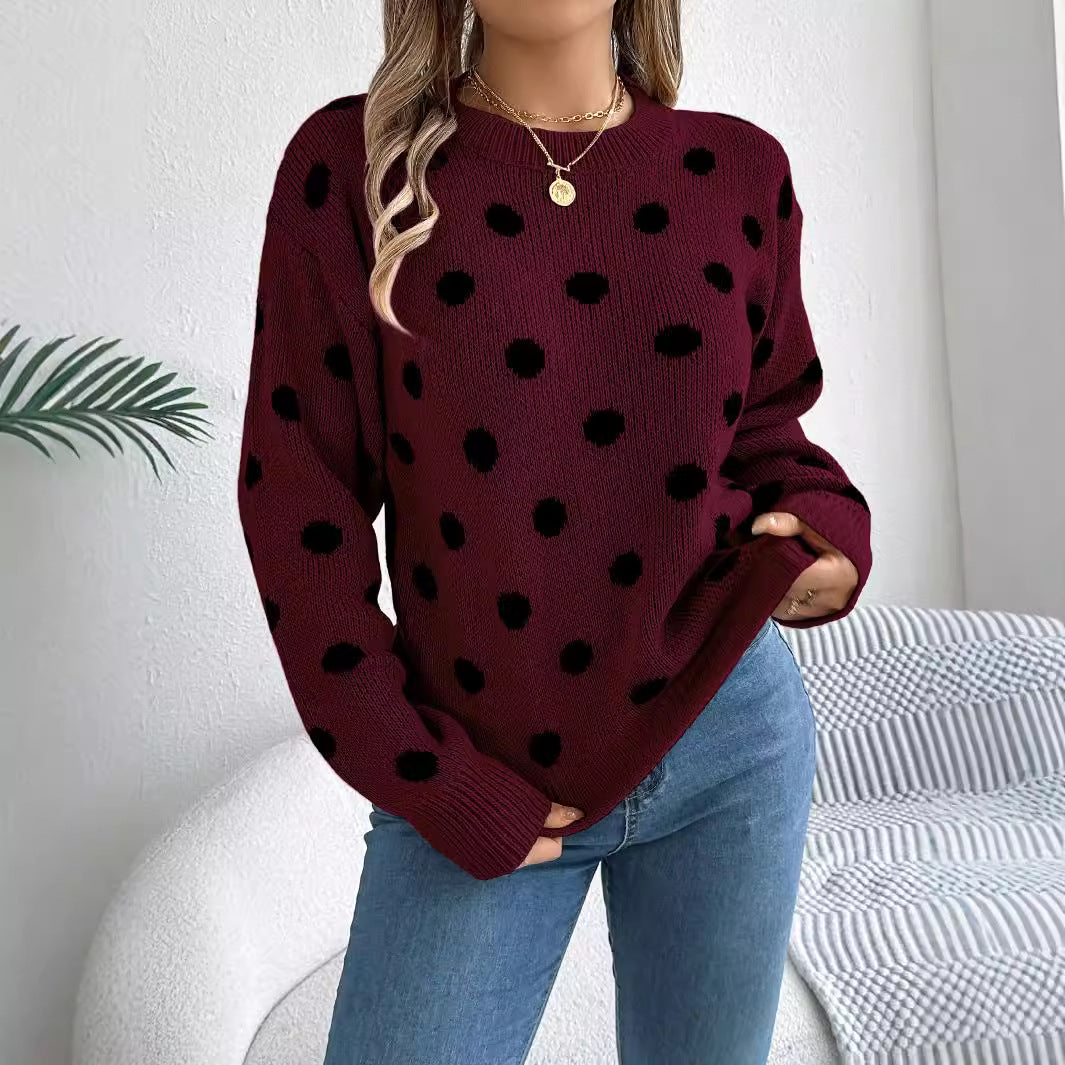 Women's polka-dot knit pullover sweater, wine red with black dot pattern and long sleeves.