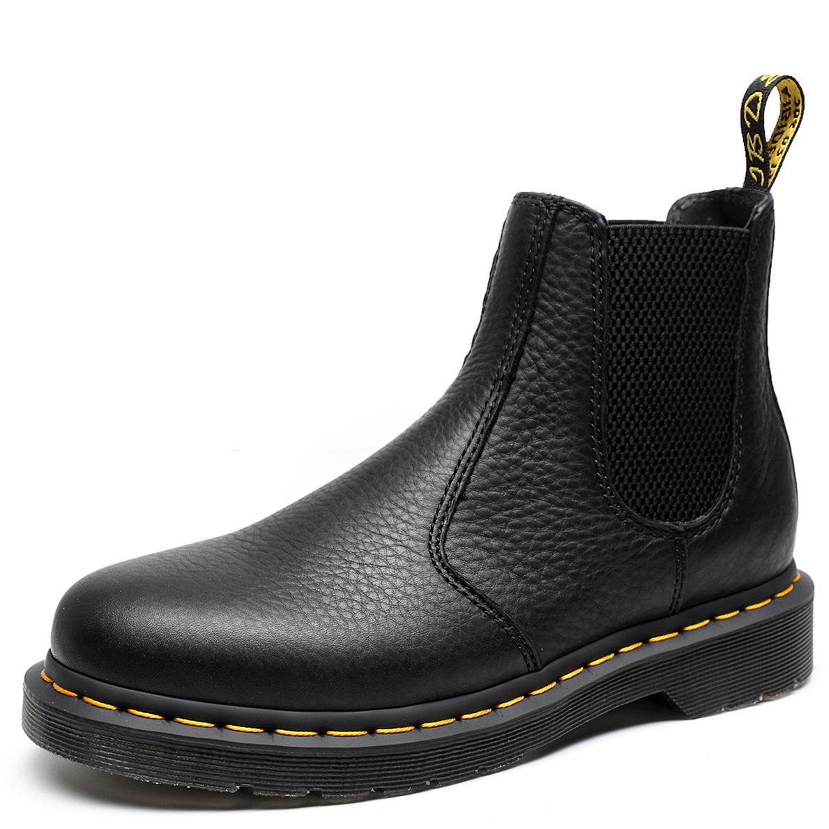 Black leather Chelsea boots with elastic side gore, round toe, yellow stitch detail