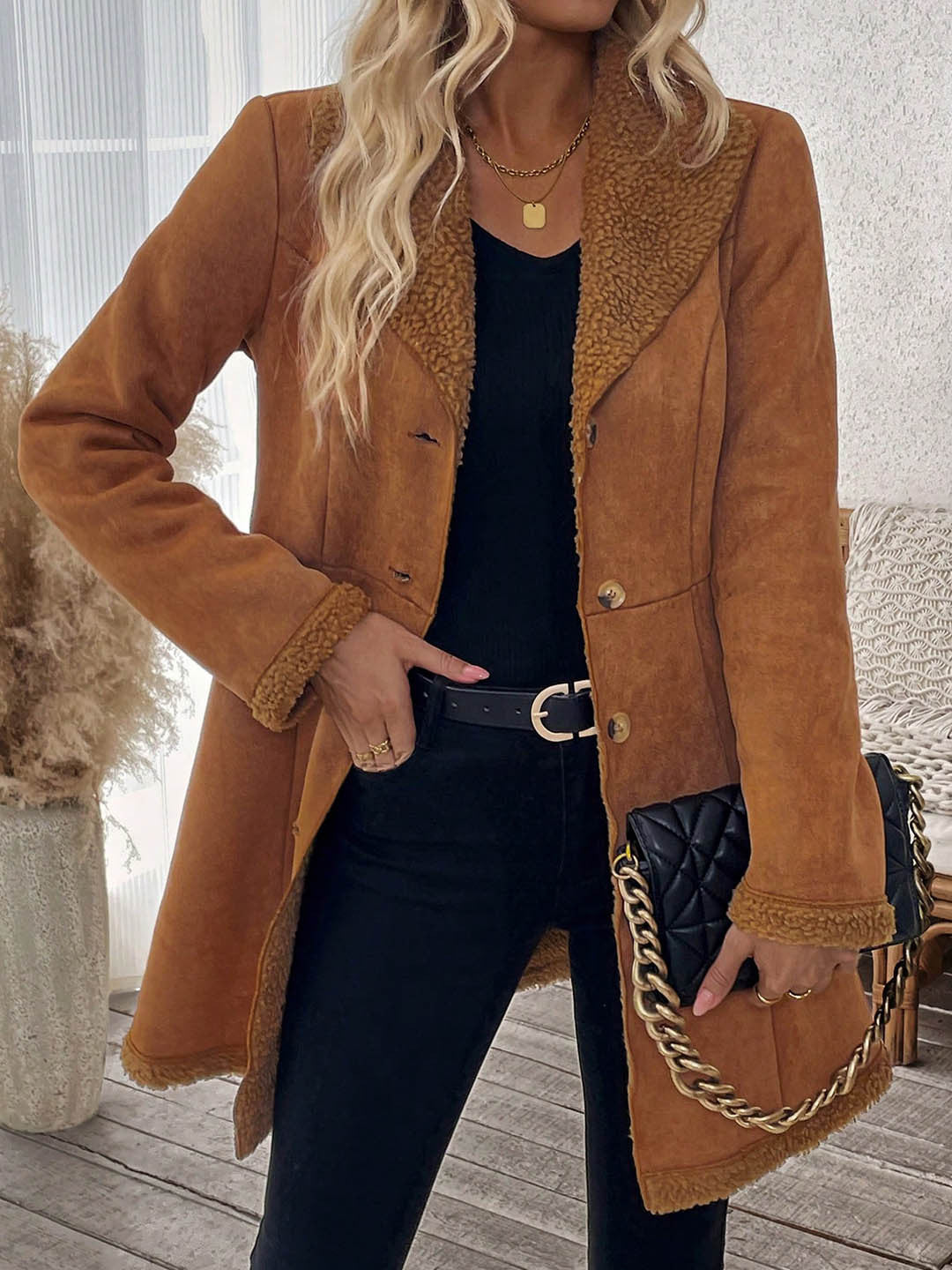 Mid-length brown suede-look jacket with shearling-trim lapel and button front.