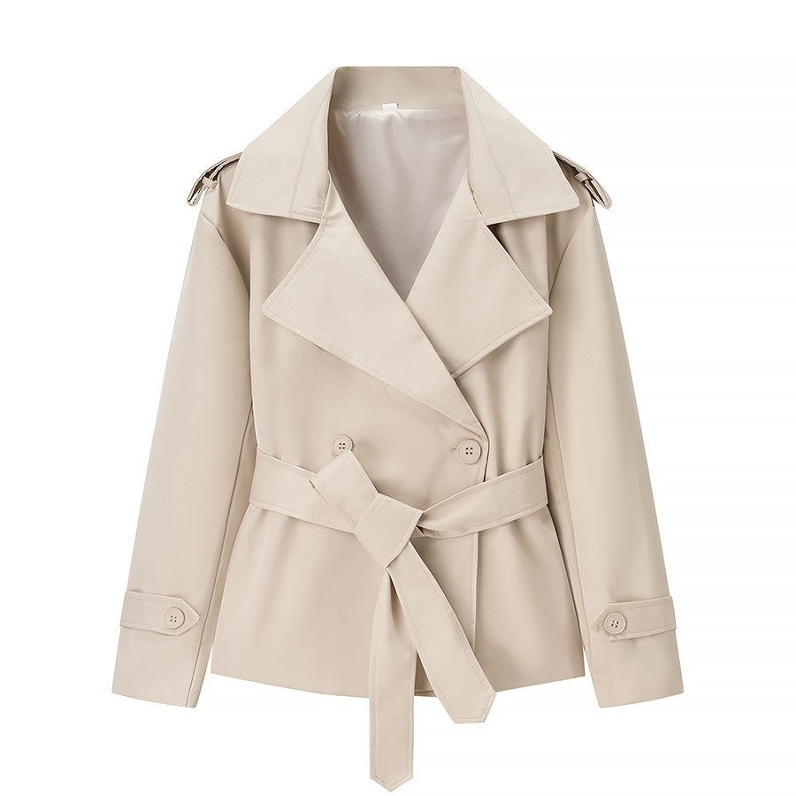 Light beige trench coat with notched lapels and self-tie belt at the waist