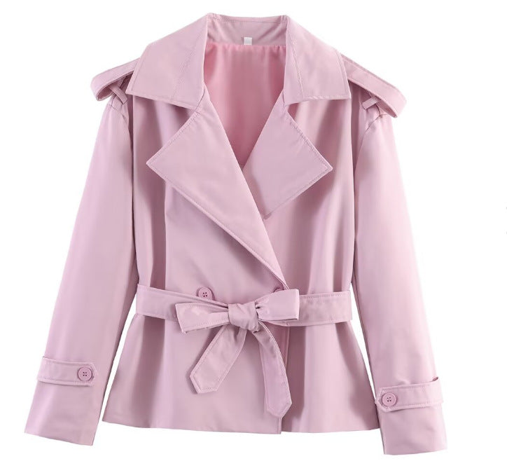 Light pink belted trench coat with notched lapels and tie waist, long sleeves