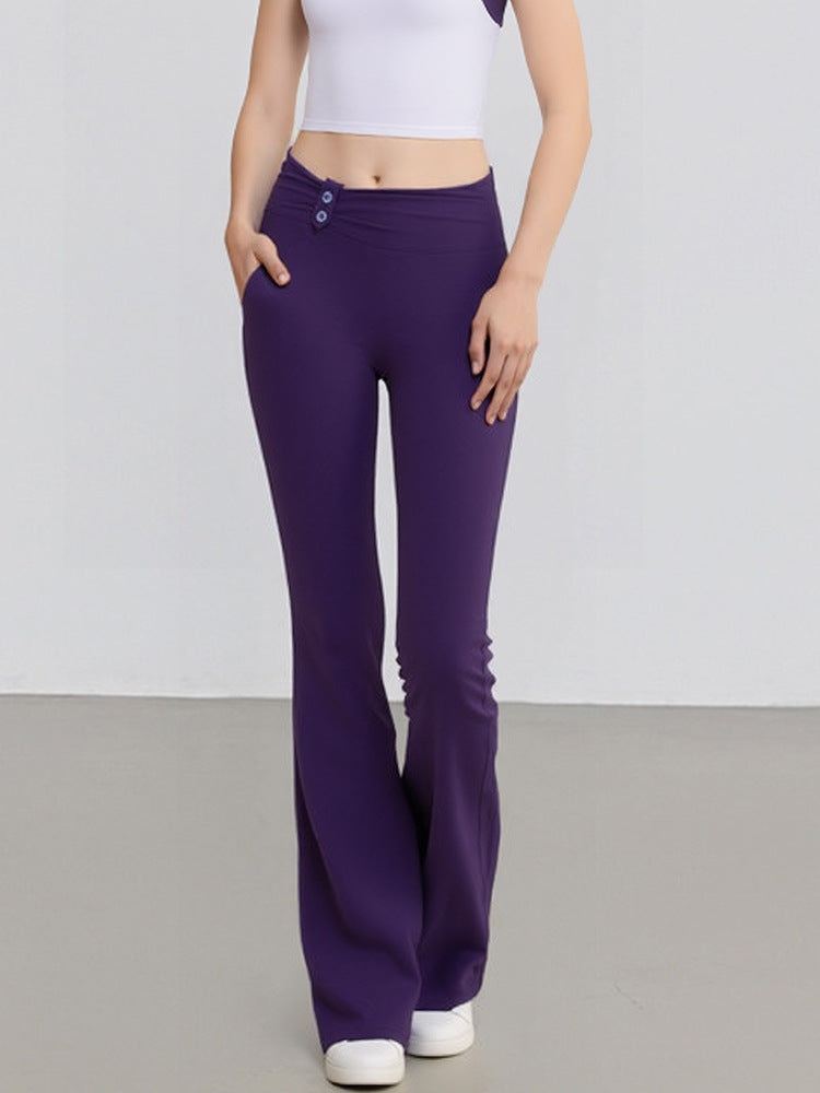 Purple high-waisted yoga flare pants with buttoned waistband, fitted through thighs