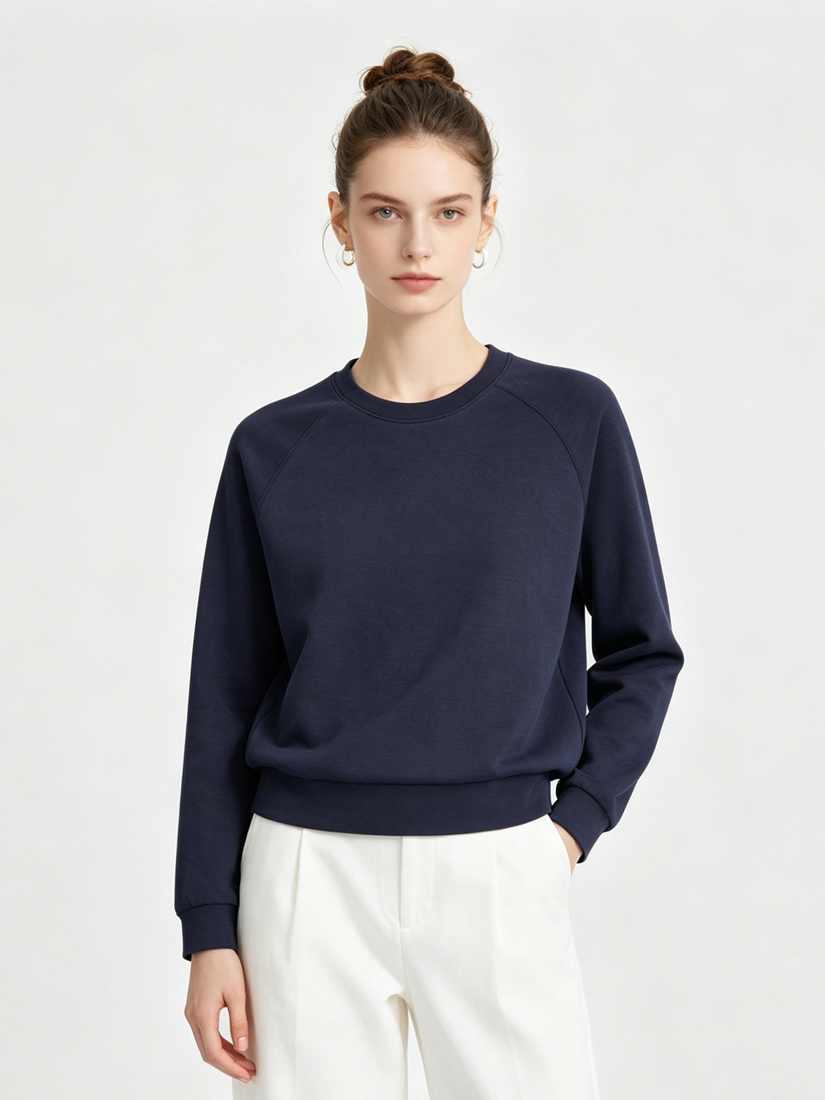 Women's navy raglan sweatshirt with crew neck, long sleeves, ribbed hem and cuffs