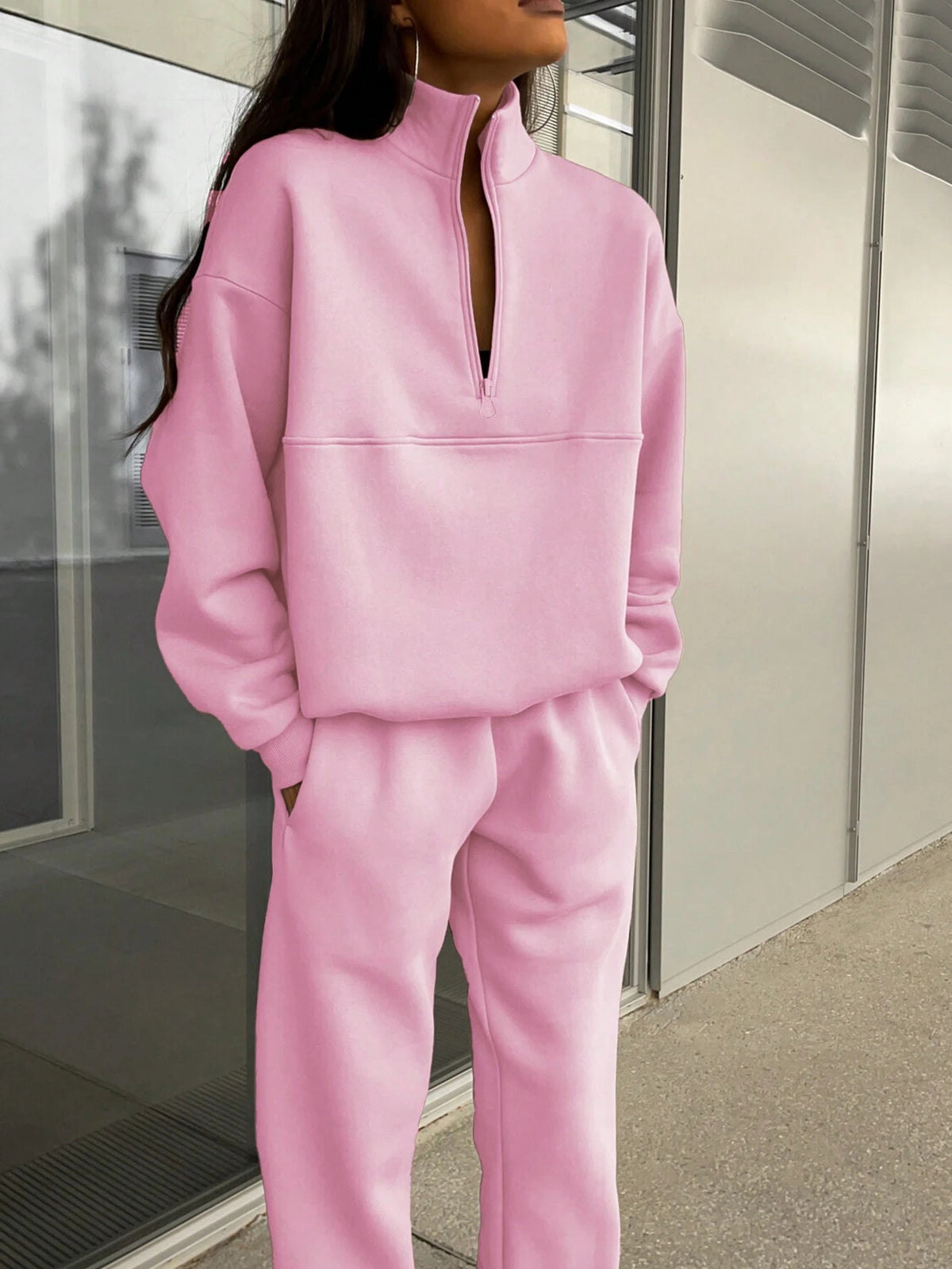 Pink zip-lapel two-piece tracksuit set with quarter-zip pullover and cuffed jogger pants