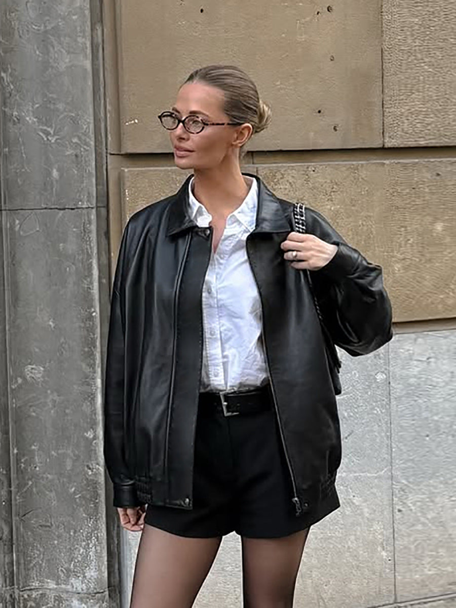 Black matte leather jacket with lapel collar and zip front, long sleeves