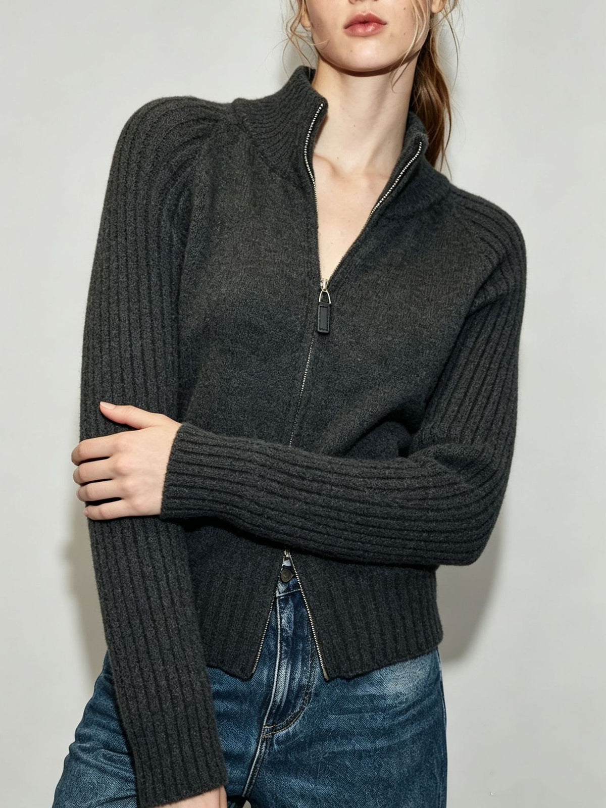Women's charcoal ribbed knit zip-up sweater jacket with stand collar and front zipper.