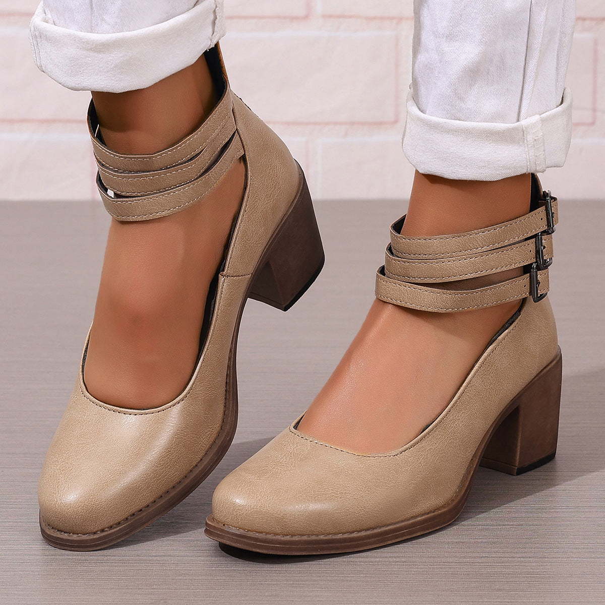 Beige ankle boots with chunky heel and double strap buckle closure