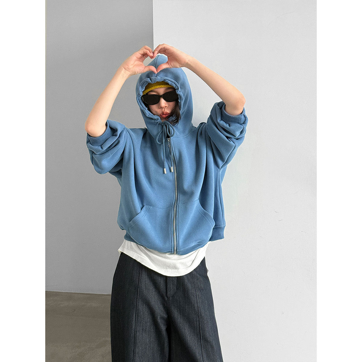 Women’s zip-up hooded sweatshirt in light blue with drawstring hood and front zipper