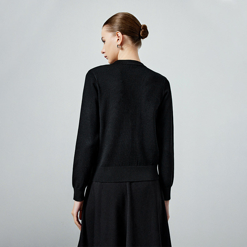 Black knit cardigan back view with ribbed hem and long sleeves