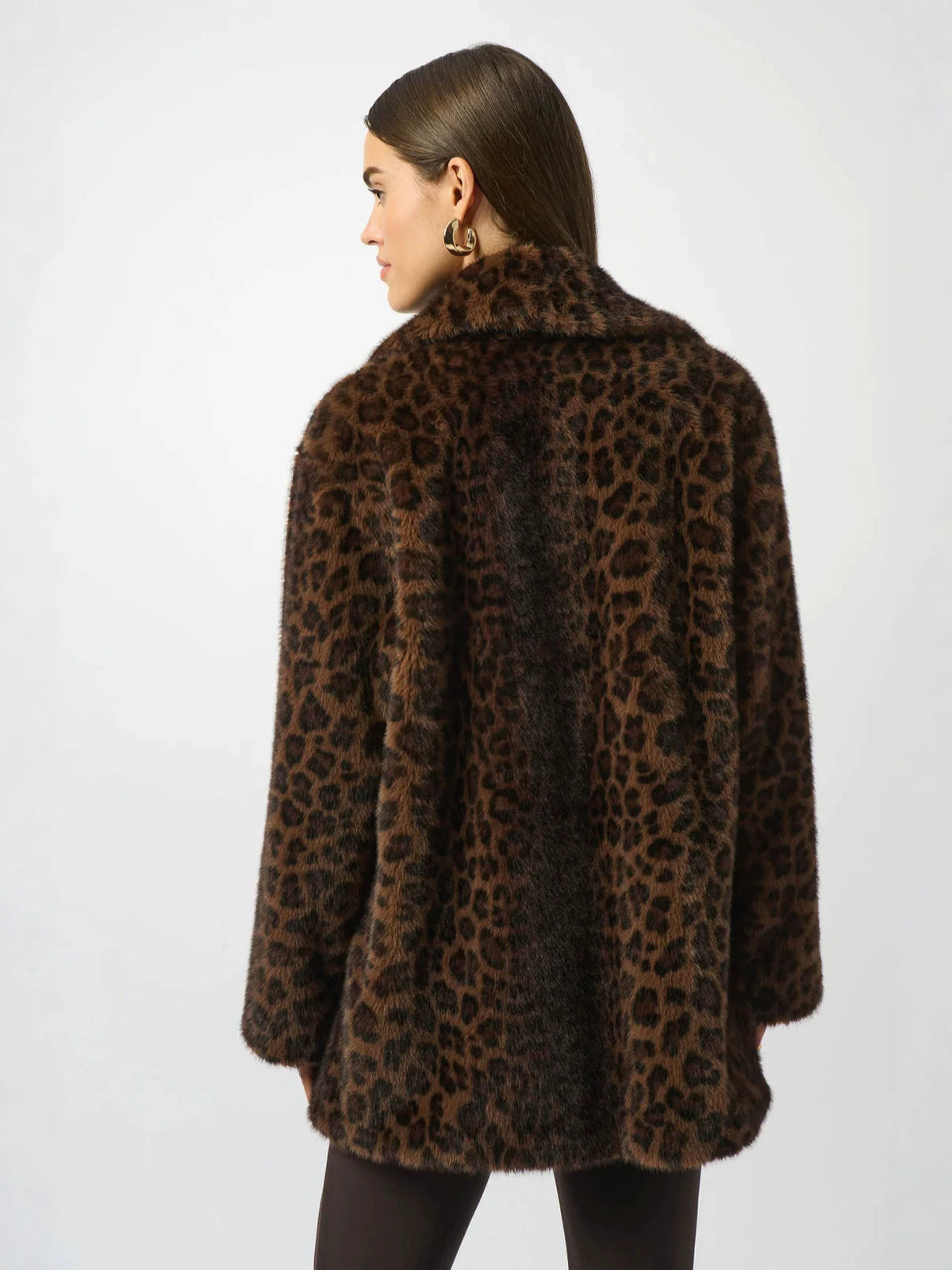 Leopard print faux fur coat back view with cape-like sleeves and plush texture.