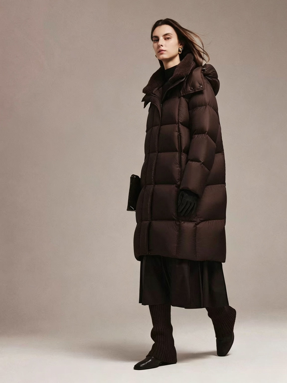Women's dark brown long quilted down jacket with high stand collar and side pockets
