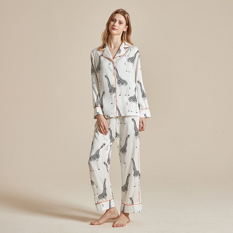 Women’s long-sleeve pajama set with white fabric, black animal print, long trousers