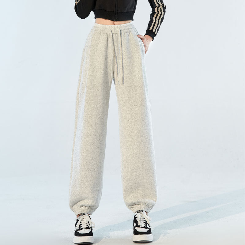 Light gray speckled high-waist jogger pants with drawstring and cuffed ankles.