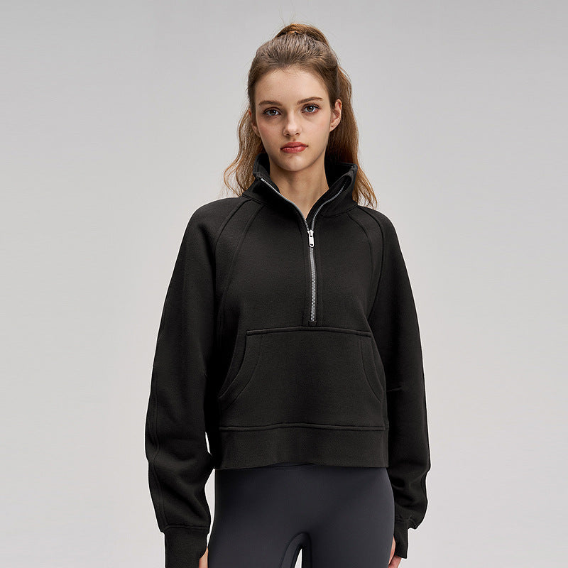 Black fleece-lined sports sweatshirt with high neck, half zip, kangaroo pocket and long sleeves