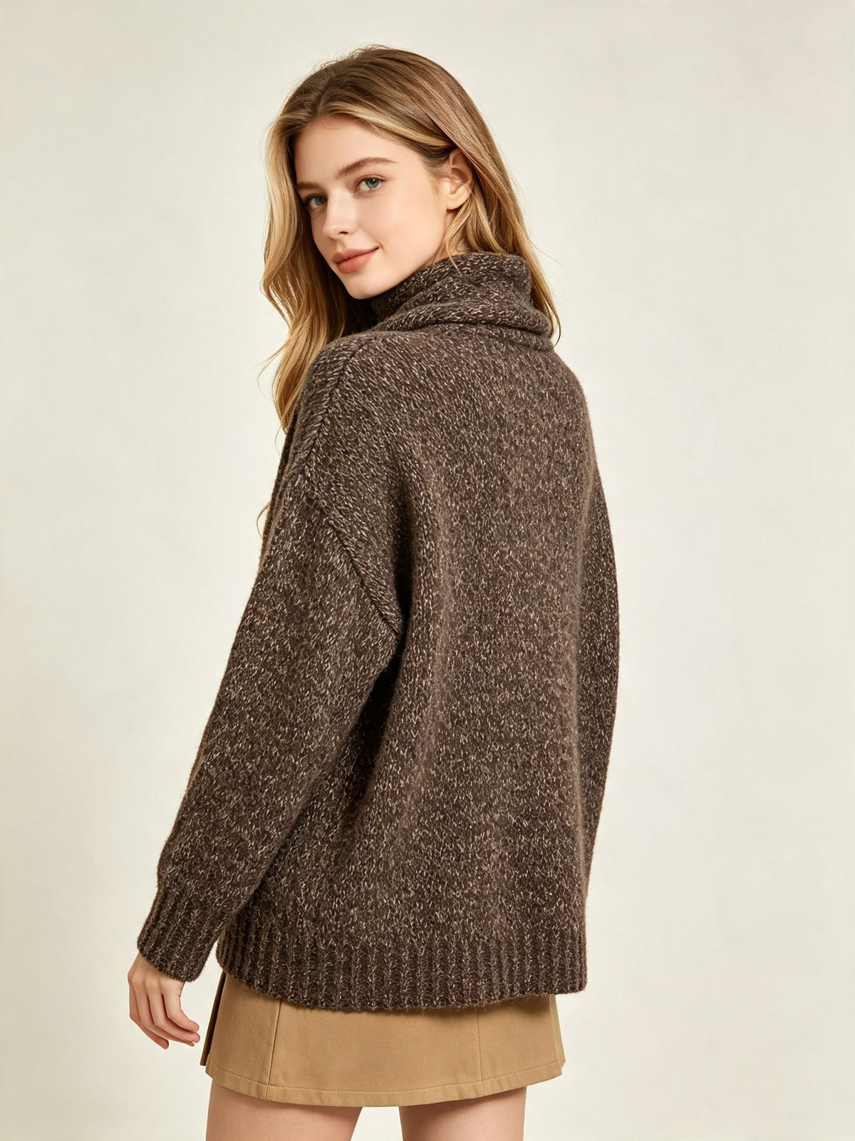 Women's brown wool knit sweater with button placket and scarf-style neck, side view