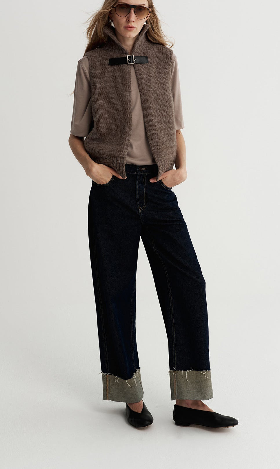 Dark brown wool knit vest with stand-up collar and black buckle fastening