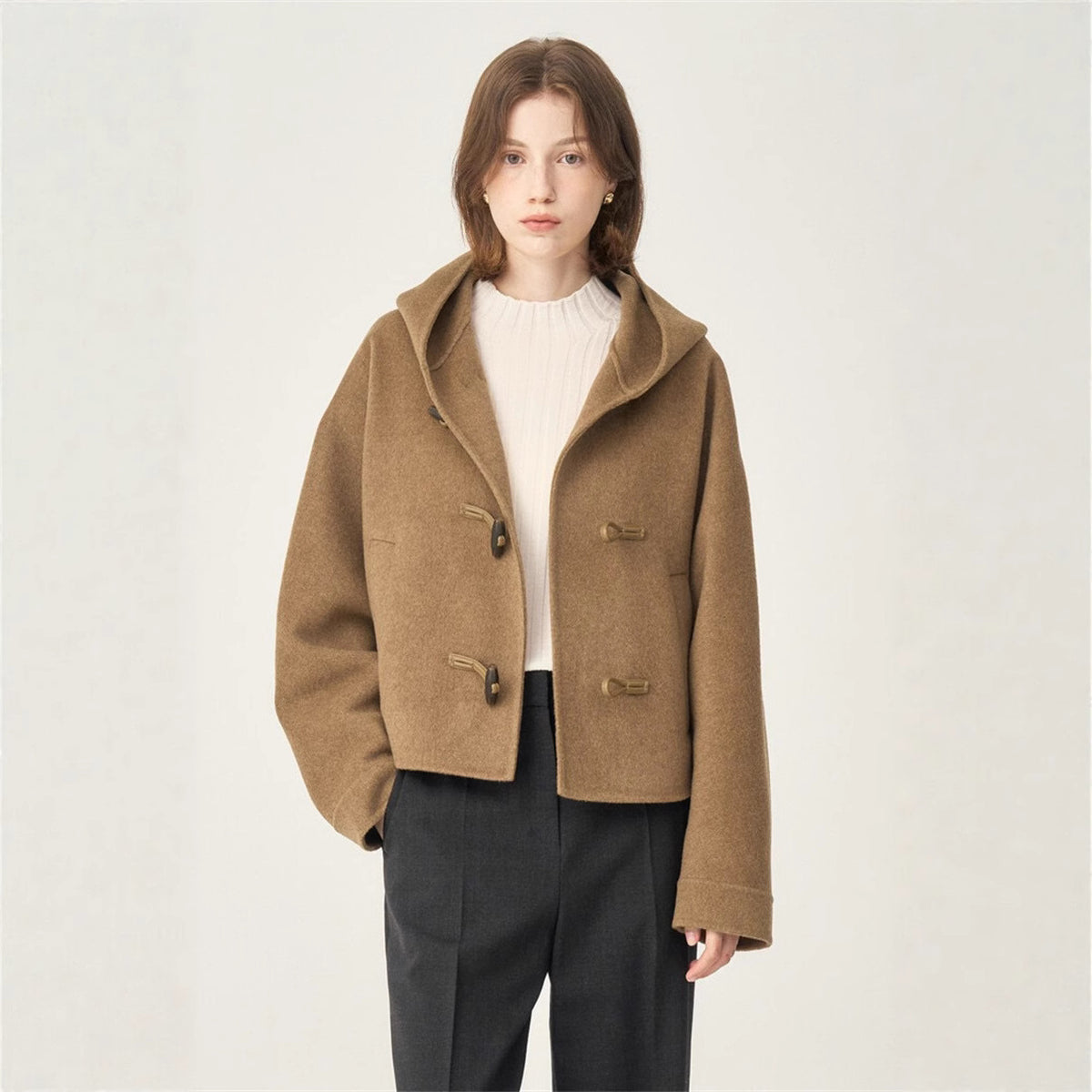 Camel short hooded wool coat with toggle front, flap pockets, and dropped hood