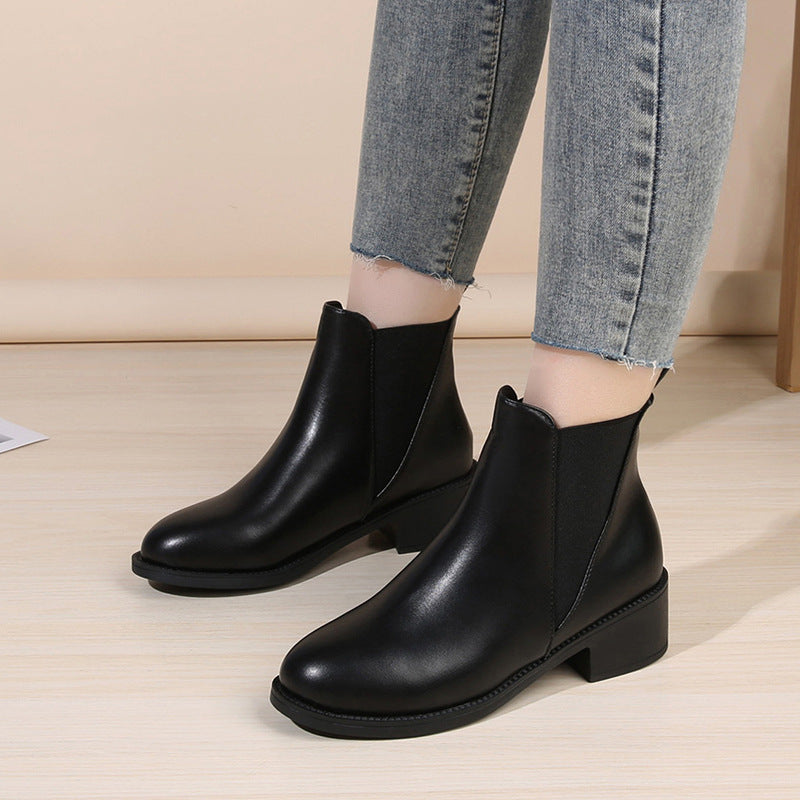 Black chelsea boots with side elastic panels and chunky block heel.