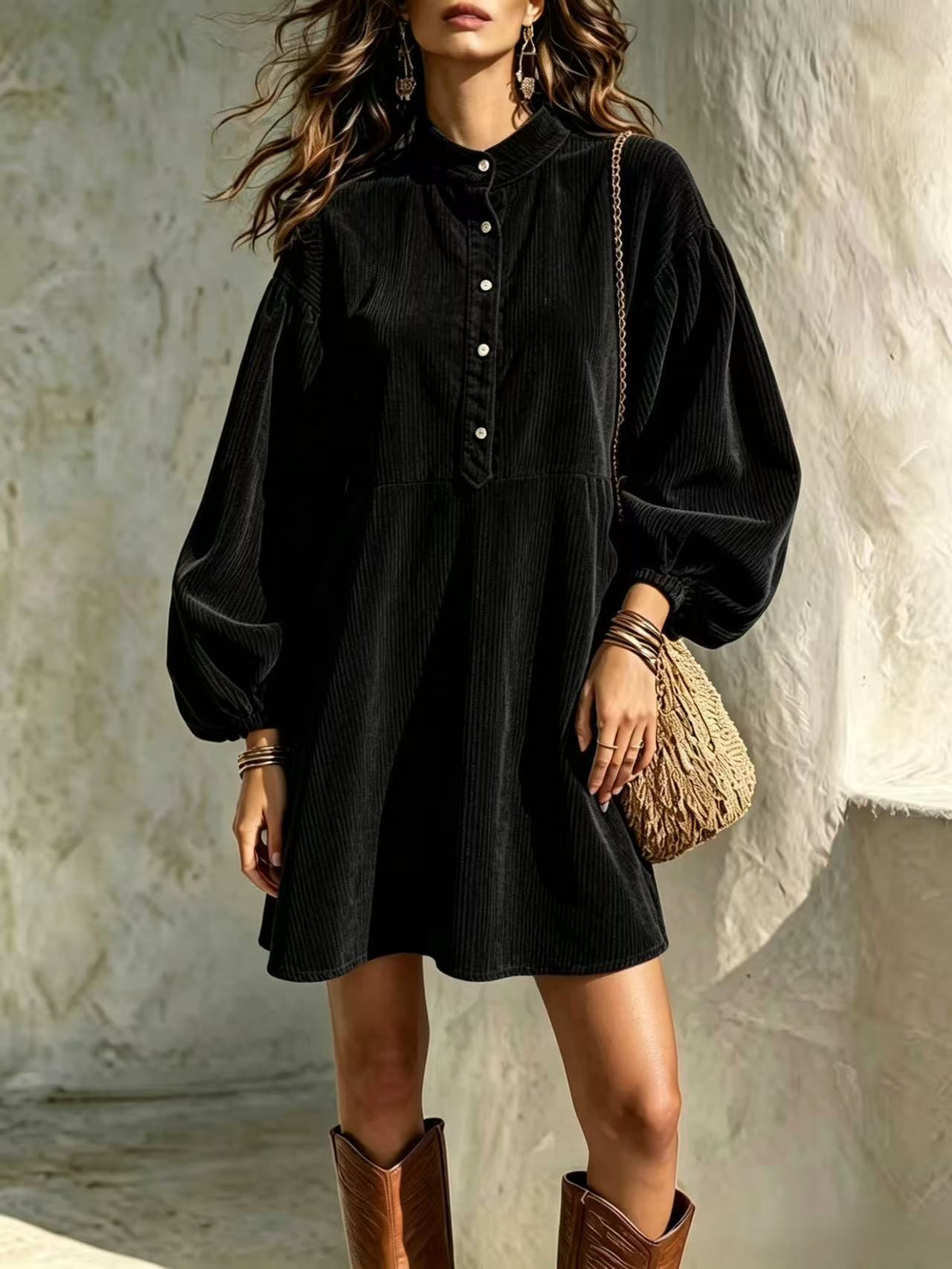 Black corduroy dress with stand-up collar, button-front, and lantern sleeves