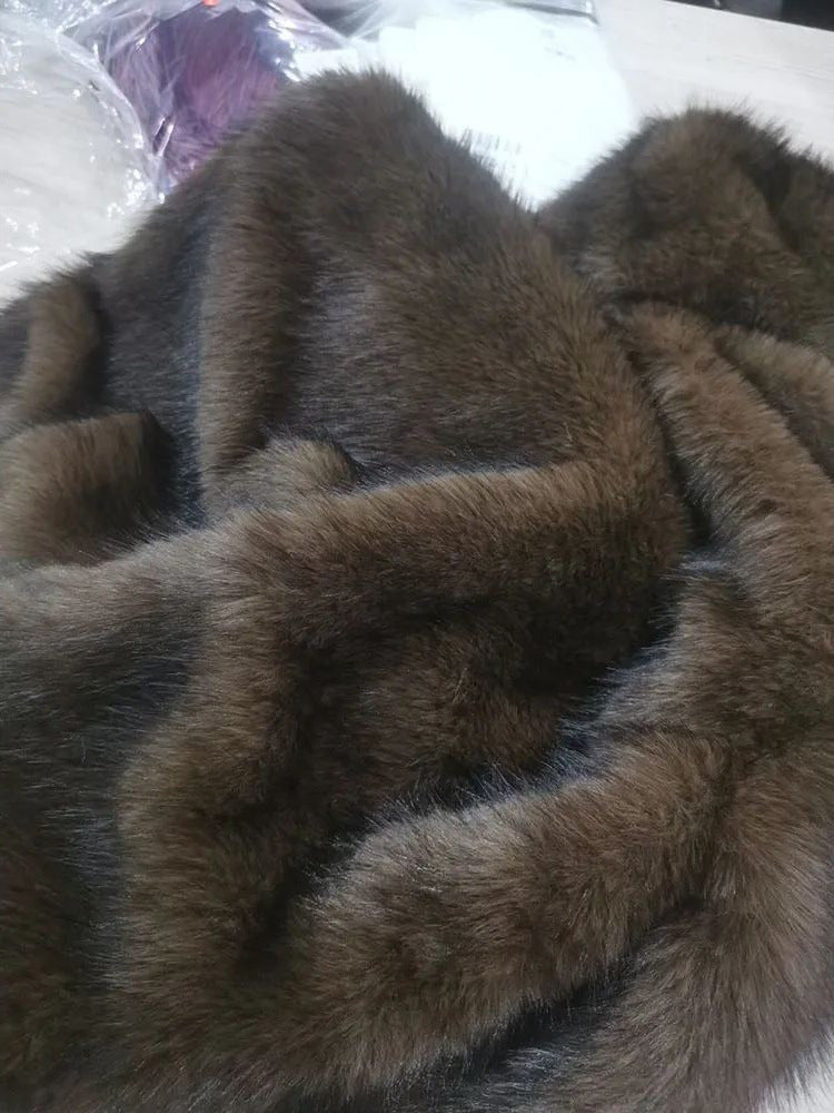 Brown faux fur fabric texture on a hooded pullover top