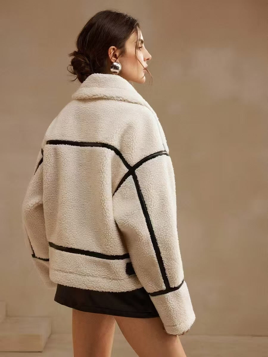 Cream sherpa jacket with black stripe trim on sleeves and sides, zip front