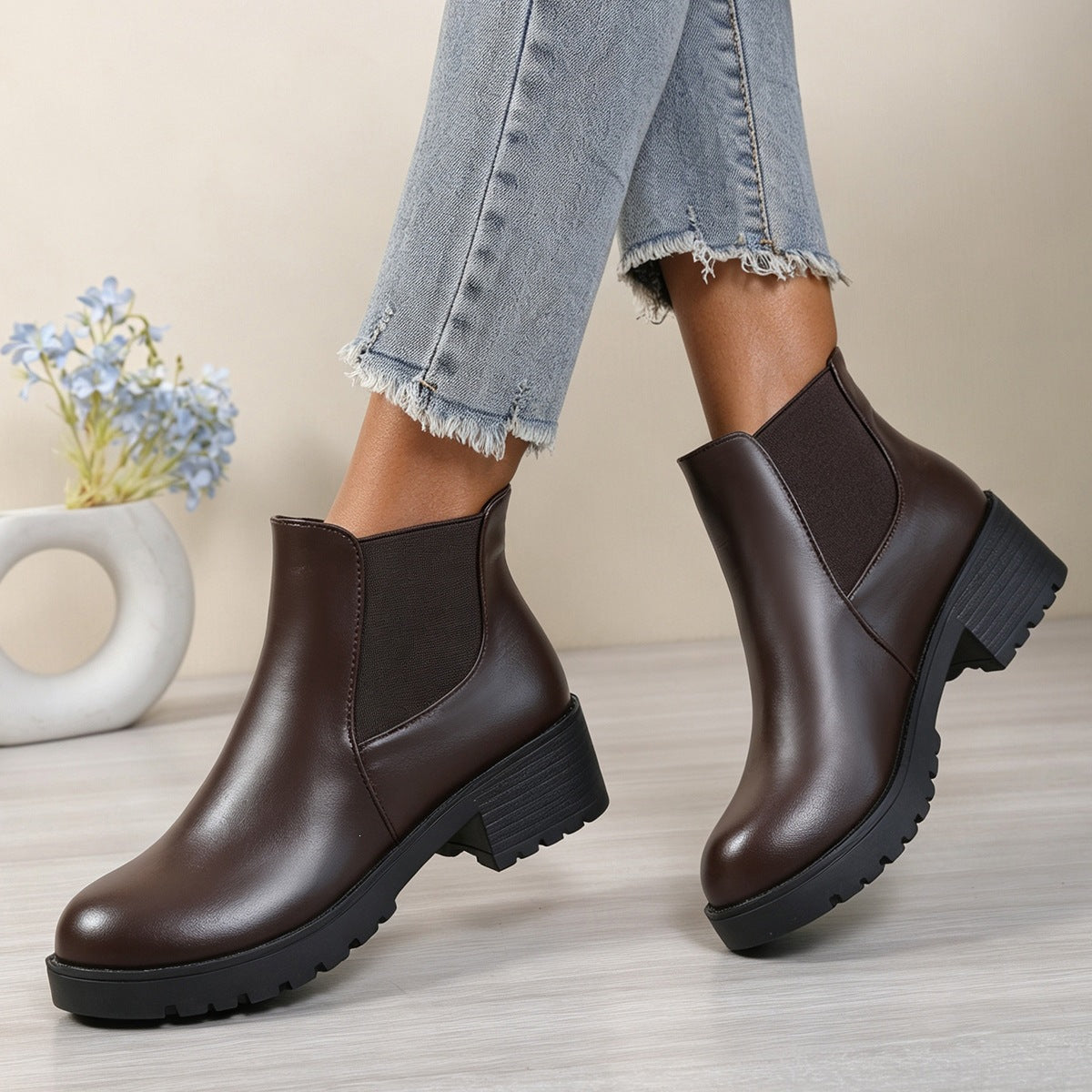 Dark brown Chelsea ankle boots with rounded toe, elastic side panels, and chunky block heel