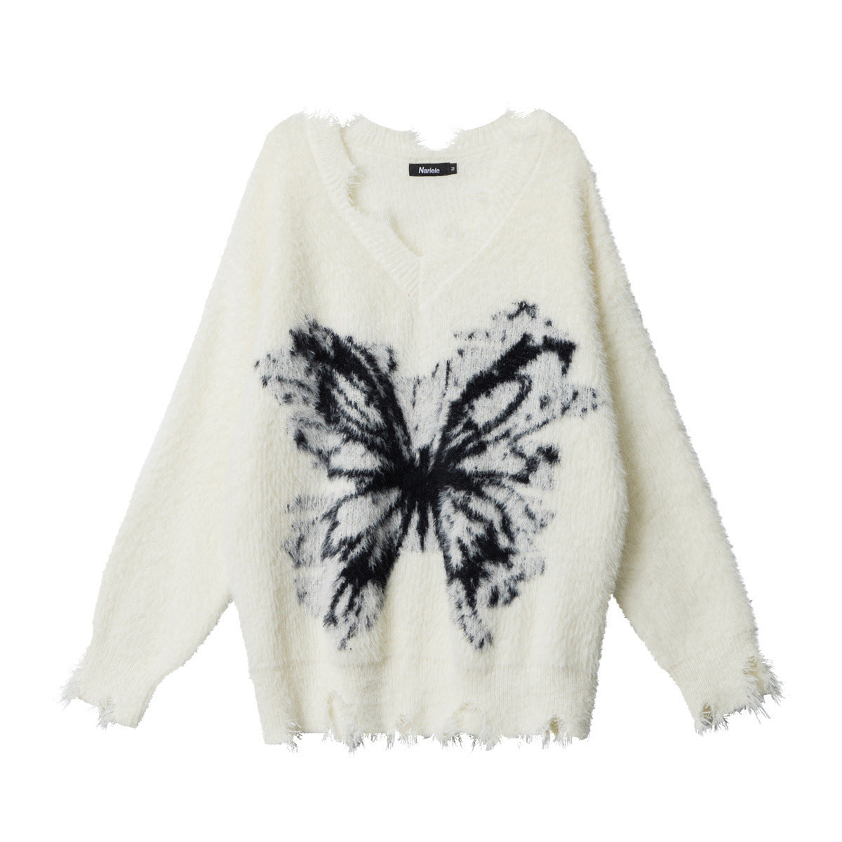 White/cream fuzzy pullover sweater with round neck and black butterfly graphic, fringed hem