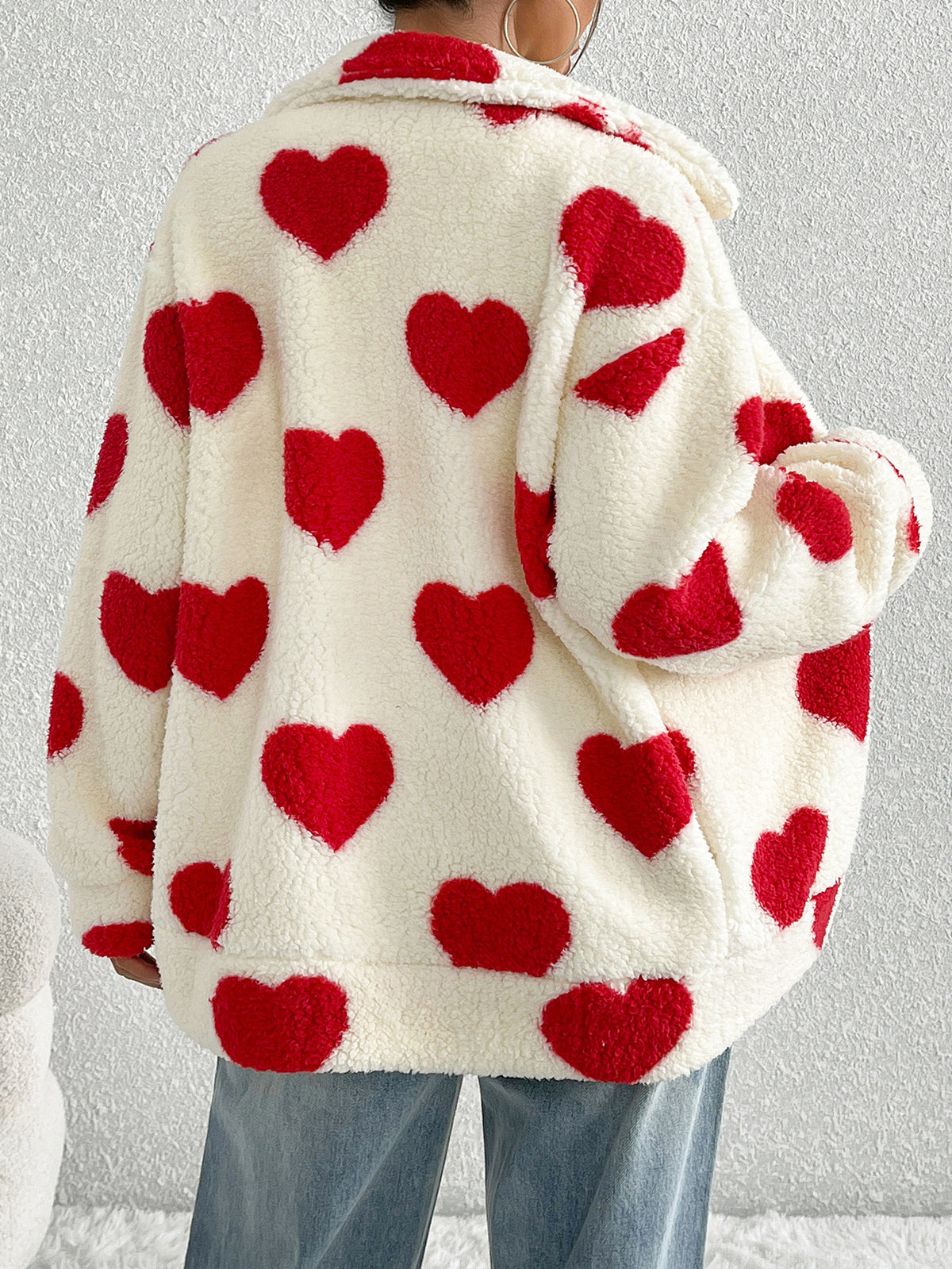 Cream plush zip-up cardigan with red heart pattern, long sleeves, relaxed fit