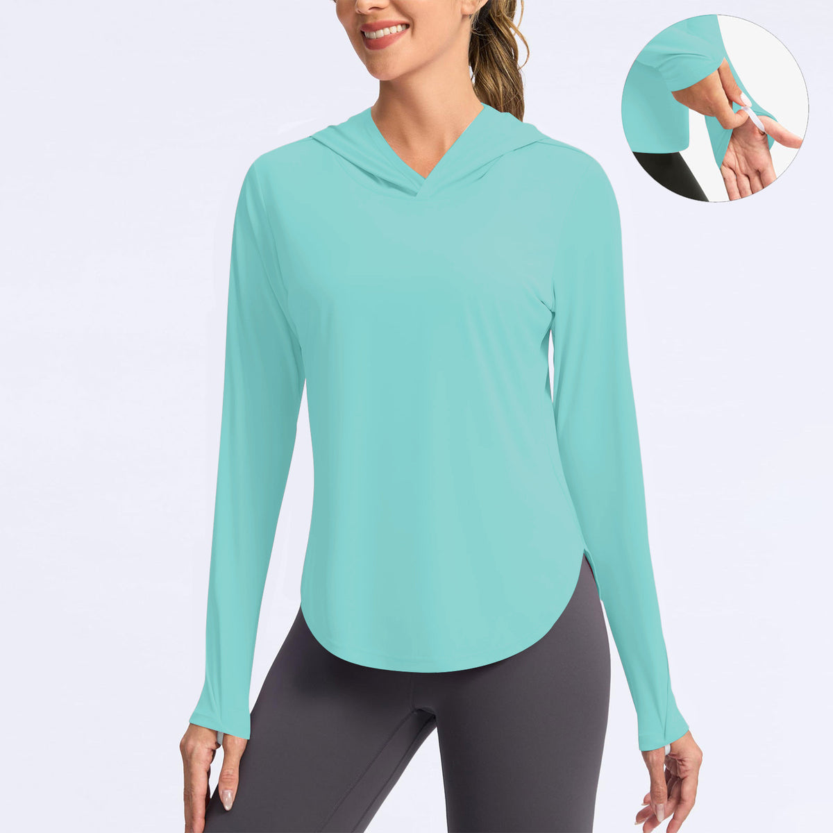 Women’s teal hooded sun protection shirt, long sleeves with thumbhole cuffs