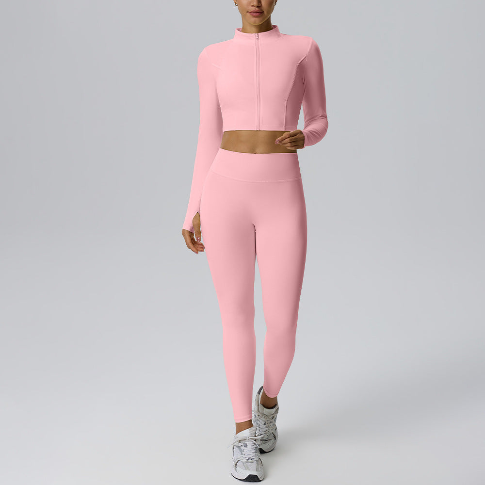 Women's pink yoga set with zip long-sleeve crop top and fitted high-rise leggings