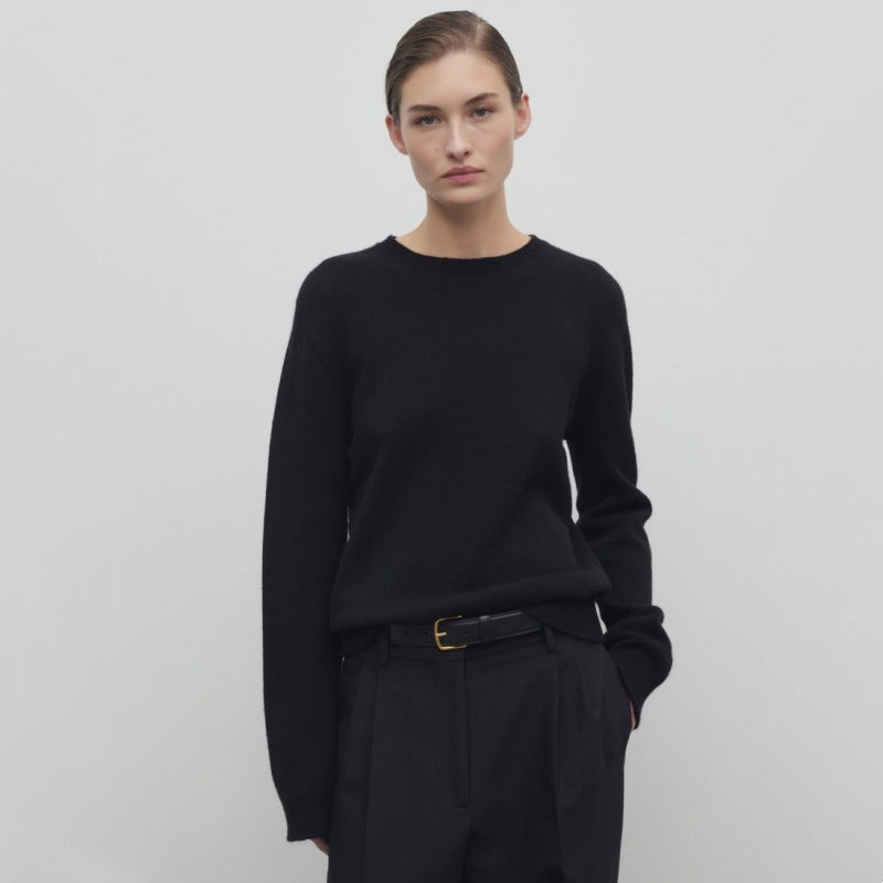 Women's black knit pullover with long sleeves and crew neckline, relaxed fit