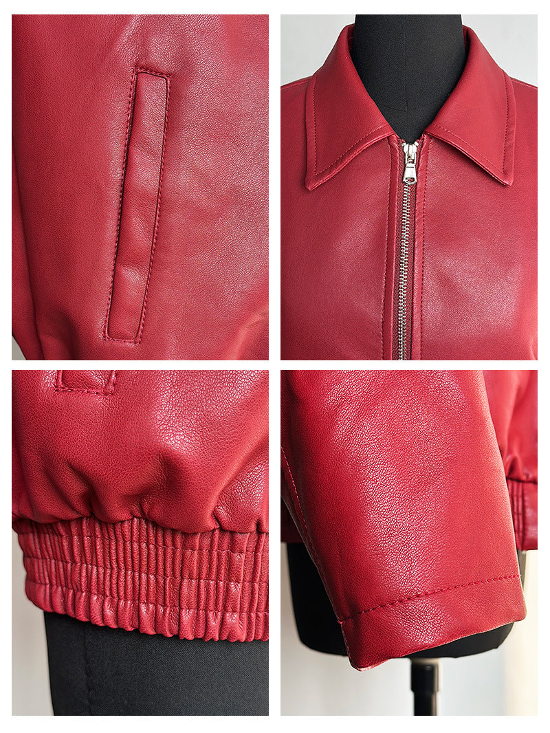 Red faux leather jacket detail view: front zipper, collar stitching, and ribbed cuffs