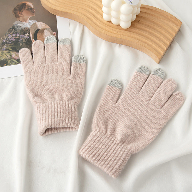 Light pink knit gloves with gray color-blocked fingertips and ribbed cuff