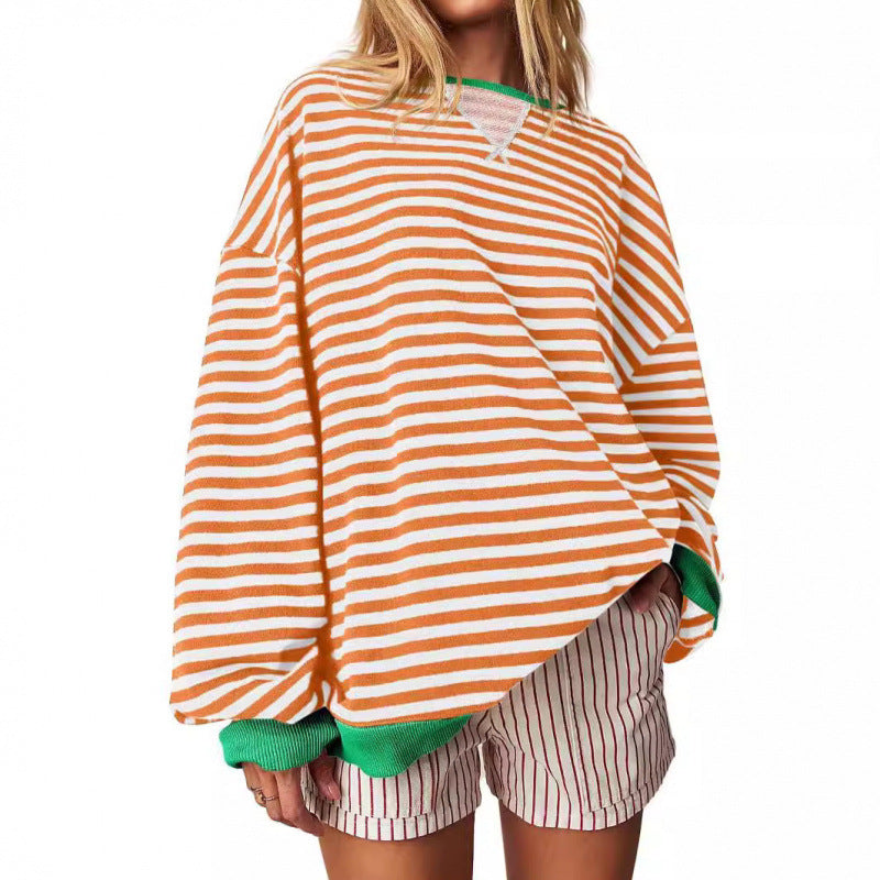 Women’s striped pullover sweatshirt with long sleeves and round neckline, orange and white.