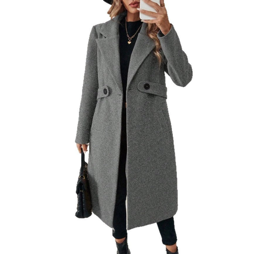 Gray wool long double-breasted coat with notched lapels and button-through center front.