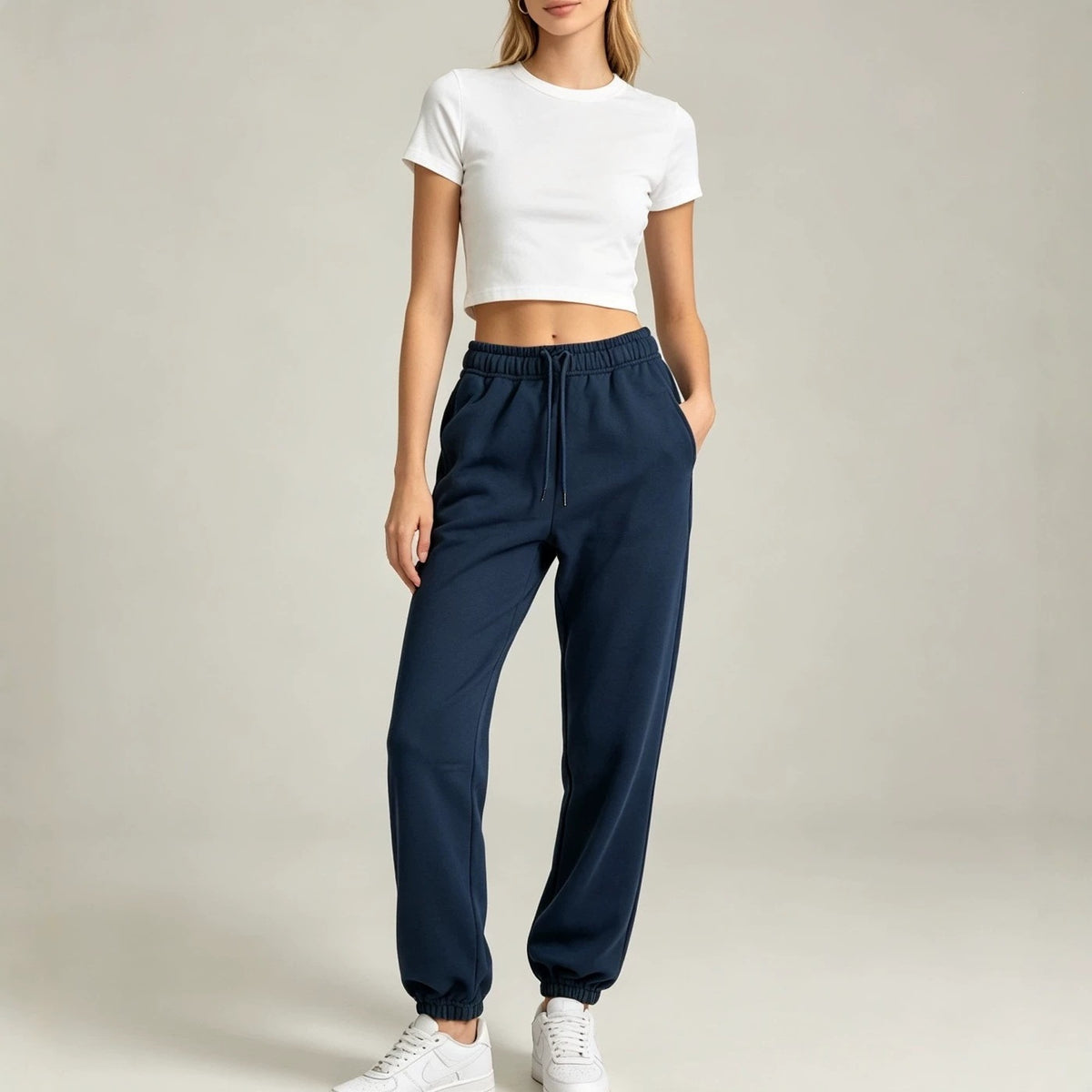 Navy blue fleece jogger sweatpants with drawstring elastic waistband and cuffed hem