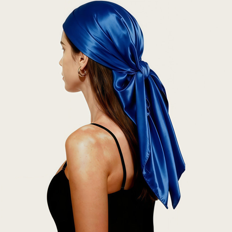 Royal blue satin square scarf headscarf tied with a long bow at the back