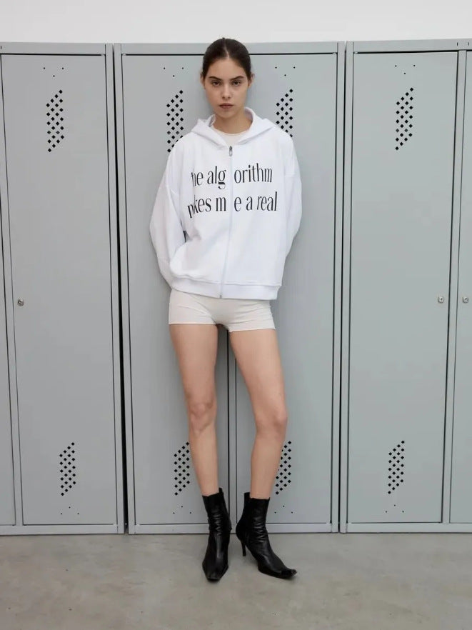 White zip-up hoodie with hood and front zipper; worn with light shorts