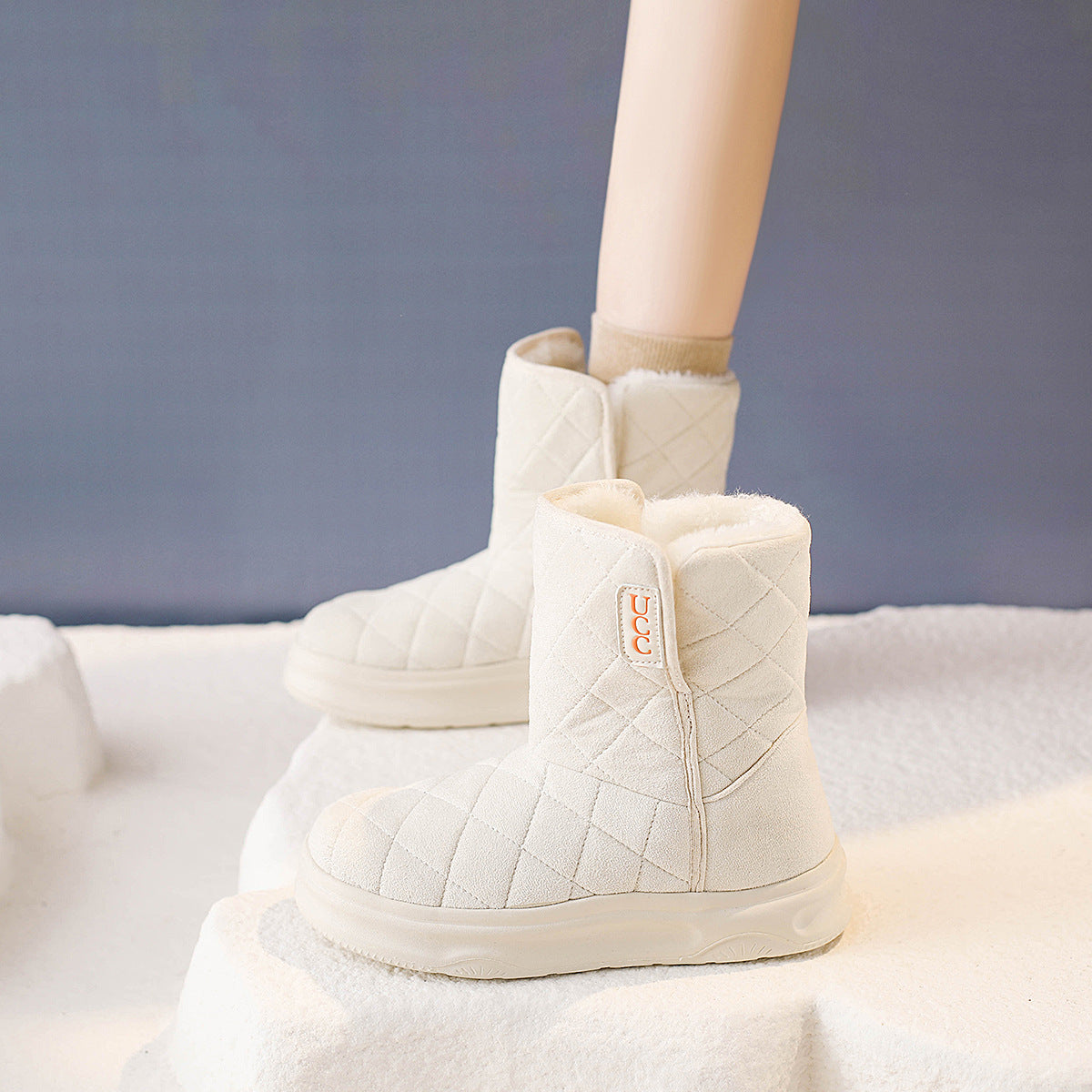 Women’s snow boots, white quilt ankle boot with fleece collar and UCC logo patch