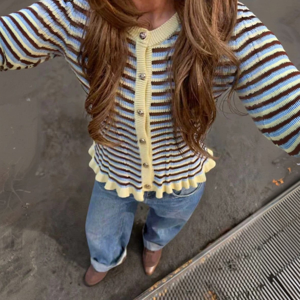 Striped ribbed cardigan with brown button-front, round neck, lettuce hem; blue/cream stripes.