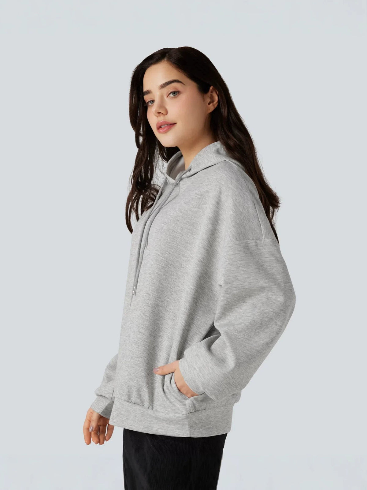 Light gray women's pullover hoodie with kangaroo pocket, long sleeves, hooded neckline