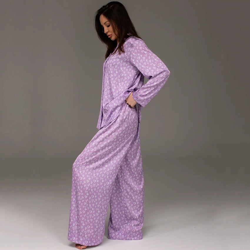 Women's lavender printed pajama set, long-sleeve button shirt with matching wide-leg pants.
