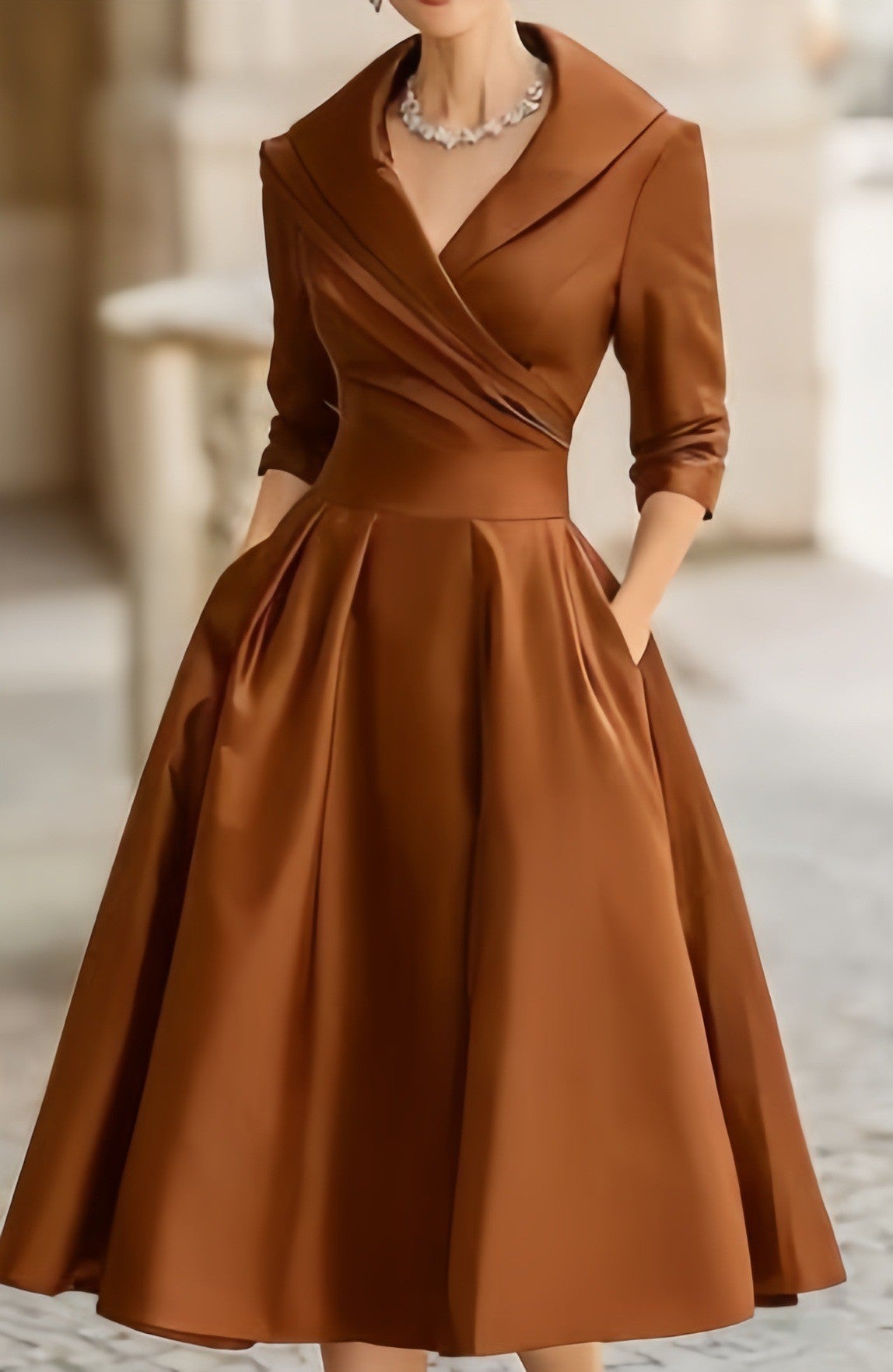 Women’s waist-cinching dress, brown, long sleeves, V-neck, gathered A-line skirt.